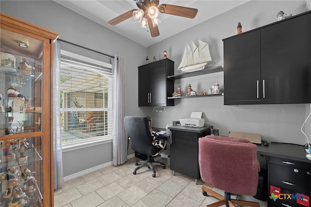 721 Gallagher Dr, Canyon Lake, TX 78133 - home office featuring a ceiling fan, baseboards, and light tile patterned floors