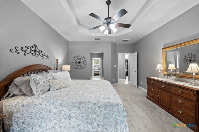721 Gallagher Dr, Canyon Lake, TX 78133 - bedroom featuring a tray ceiling, light colored carpet, baseboards, and ceiling fan
