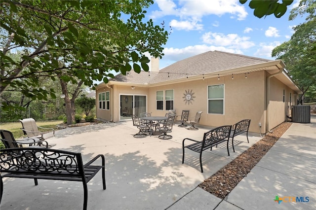 721 Gallagher Dr, Canyon Lake, TX 78133 - back of house with cooling unit, a patio area, stucco siding, and a shingled roof