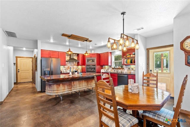 dining room with a notable chandelier and a textured ceiling