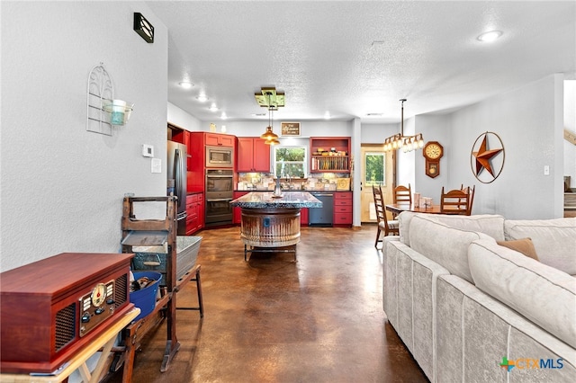 living room with a textured ceiling