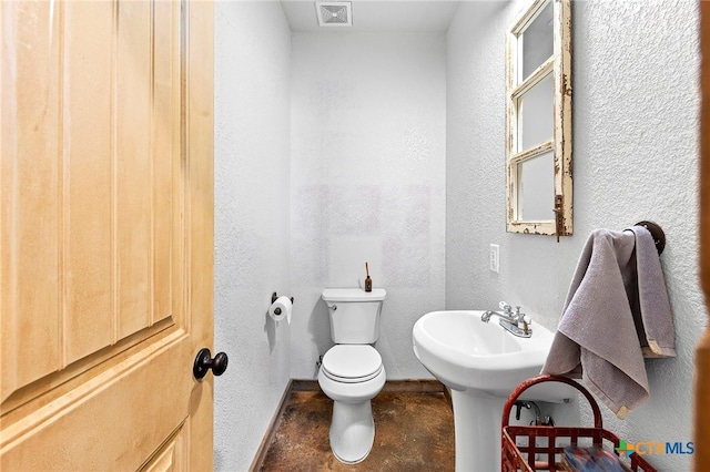 bathroom with sink and toilet