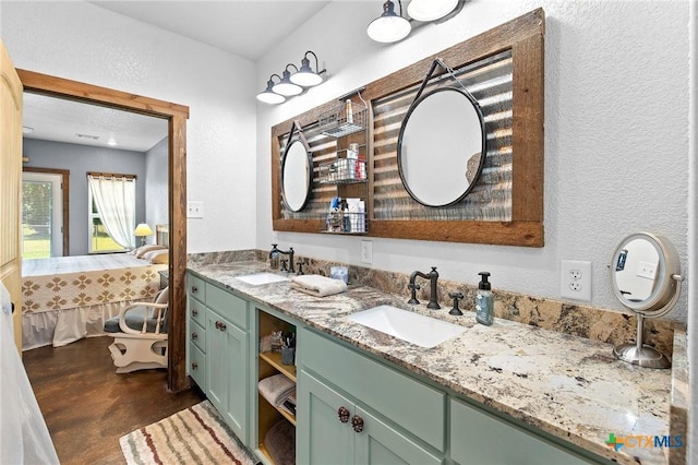 463 County Road 436, Thorndale, TX 76577 - bathroom with ensuite bath, finished concrete flooring, double vanity, and a textured wall