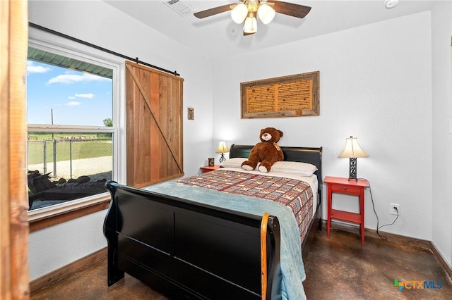 bedroom with a barn door and ceiling fan