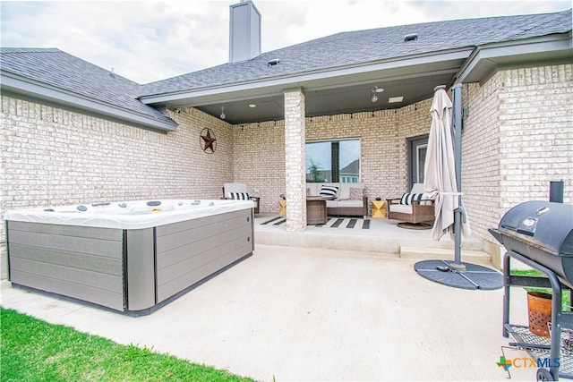 2109 Mercer St, Nolanville, TX 76559 - view of patio with outdoor lounge area, a hot tub, and grilling area