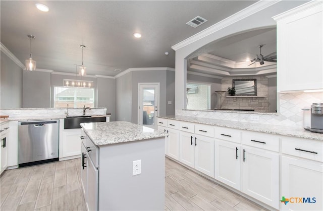 2109 Mercer St, Nolanville, TX 76559 - kitchen with dishwasher, a center island, tasteful backsplash, and ceiling fan