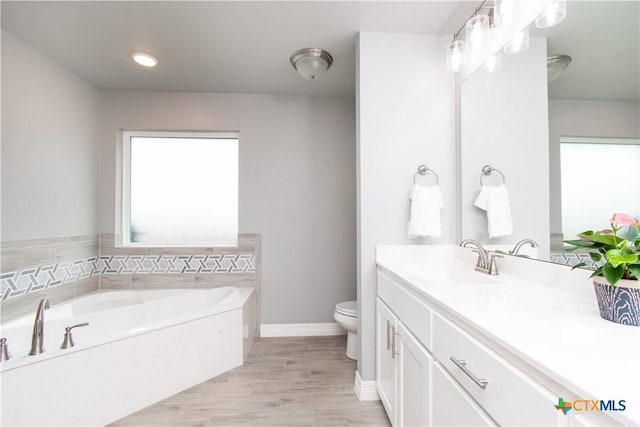 2109 Mercer St, Nolanville, TX 76559 - full bathroom with toilet, wood finished floors, a bath, baseboards, and vanity