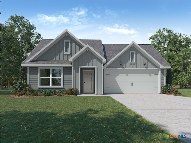 view of front of home with a garage and a front lawn