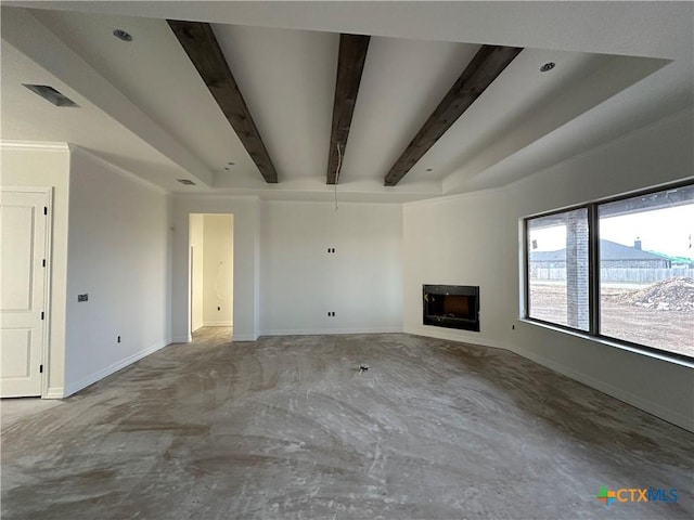 unfurnished living room with beam ceiling