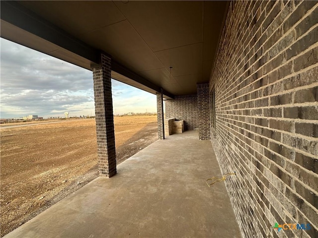 view of patio with a rural view