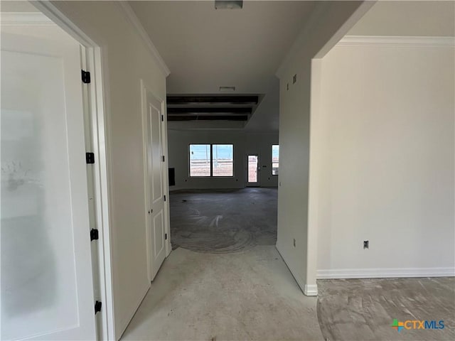 hallway featuring ornamental molding