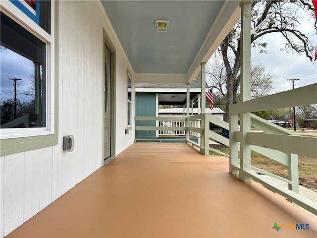 balcony featuring a porch