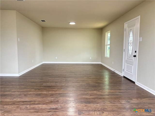 entrance foyer featuring dark hardwood / wood-style flooring