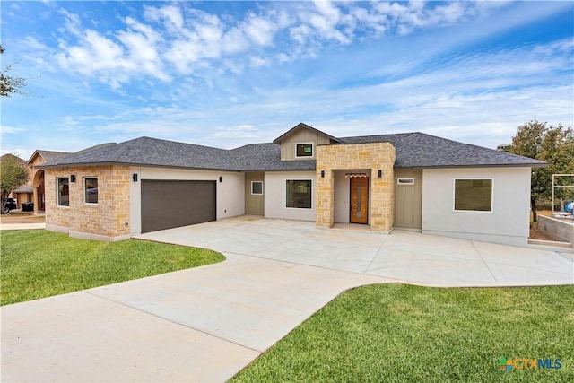 prairie-style house with a garage and a front yard