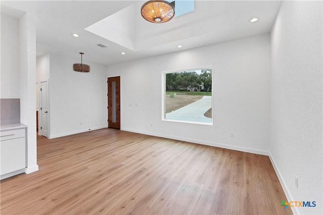 unfurnished living room featuring light wood-type flooring