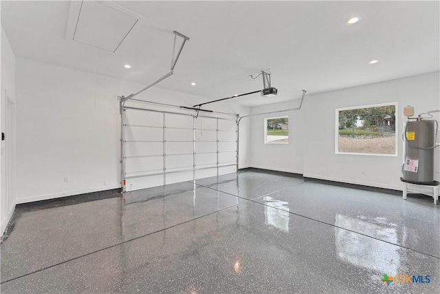 garage with a garage door opener and water heater