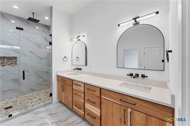 bathroom featuring walk in shower and vanity