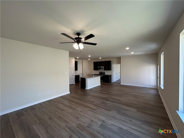250 Wind Ridge Dr, Copperas Cove, TX 76522 - unfurnished living room featuring recessed lighting, dark wood-style flooring, and baseboards