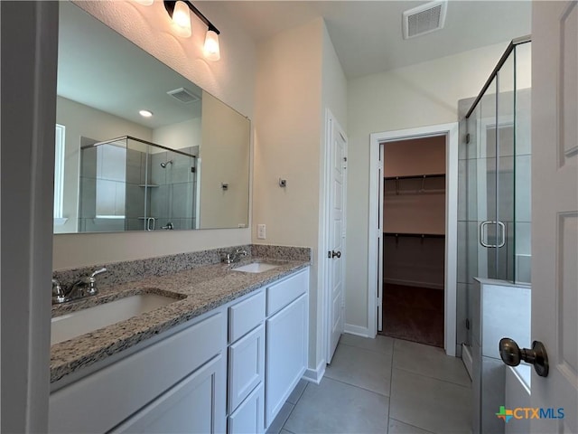 250 Wind Ridge Dr, Copperas Cove, TX 76522 - full bath featuring a sink, visible vents, a walk in closet, and a stall shower