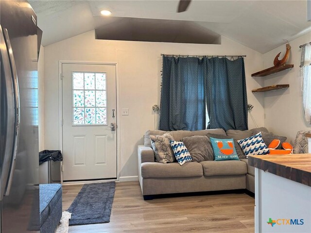 1008 W Dallas Ave, Seadrift, TX 77983 - living area with vaulted ceiling and light wood finished floors