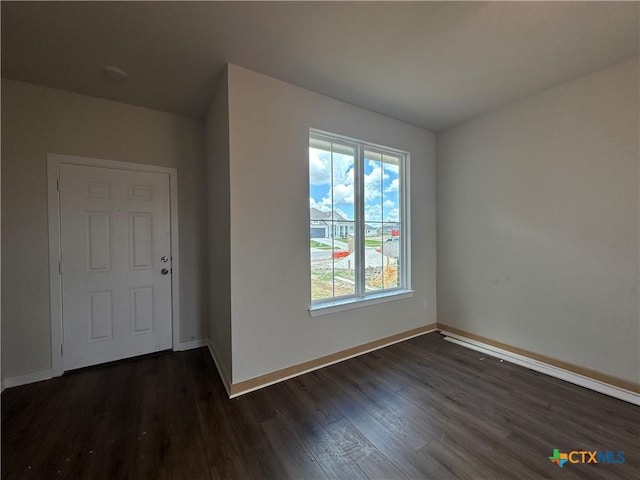 907 James Parker Cir, Killeen, TX 76542 - spare room featuring dark wood-type flooring and baseboards
