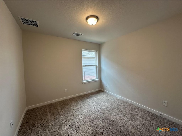 907 James Parker Cir, Killeen, TX 76542 - carpeted empty room featuring baseboards and a textured ceiling