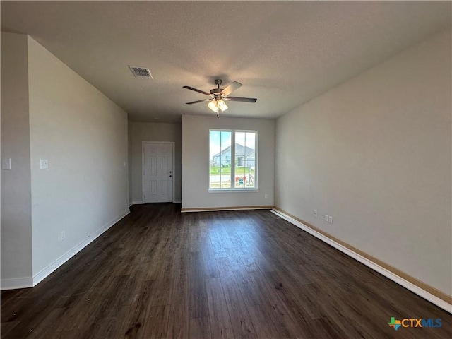 907 James Parker Cir, Killeen, TX 76542 - spare room featuring a ceiling fan, dark wood-style floors, and a textured ceiling