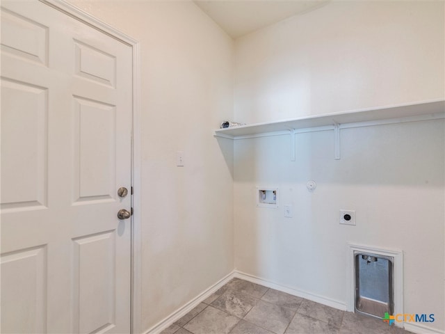 washroom featuring electric dryer hookup, hookup for a gas dryer, hookup for a washing machine, and light tile patterned floors