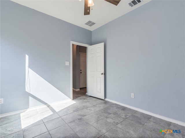 spare room with ceiling fan