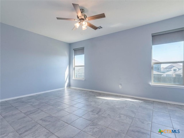 spare room featuring ceiling fan