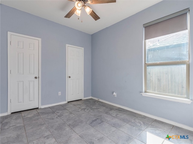 spare room featuring ceiling fan