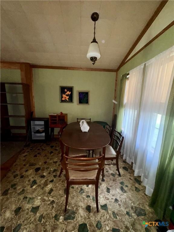 235 Murray Ln, Gatesville, TX 76528 - dining space featuring ornamental molding, stone finish floors, and lofted ceiling