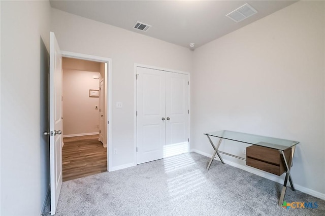 bedroom with a closet and carpet flooring