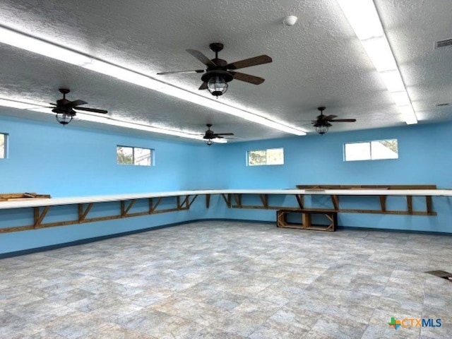 2772 Cloisters Dr, College Station, TX 77845 - interior space featuring a textured ceiling and baseboards