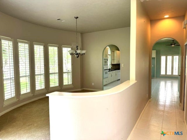 2772 Cloisters Dr, College Station, TX 77845 - hallway featuring arched walkways, tile patterned floors, and recessed lighting