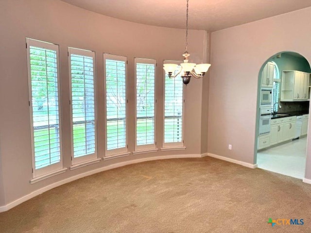 2772 Cloisters Dr, College Station, TX 77845 - carpeted spare room featuring a chandelier and a sink