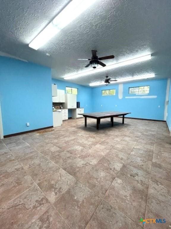 2772 Cloisters Dr, College Station, TX 77845 - playroom with a textured ceiling and a ceiling fan