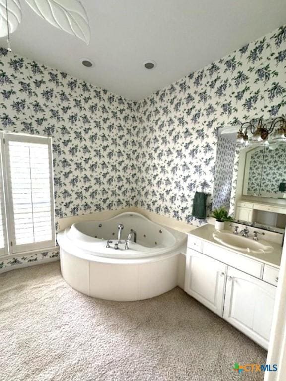 2772 Cloisters Dr, College Station, TX 77845 - bathroom featuring wallpapered walls, vanity, and a jetted tub