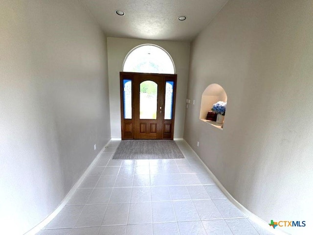 2772 Cloisters Dr, College Station, TX 77845 - foyer entrance featuring light tile patterned floors and recessed lighting