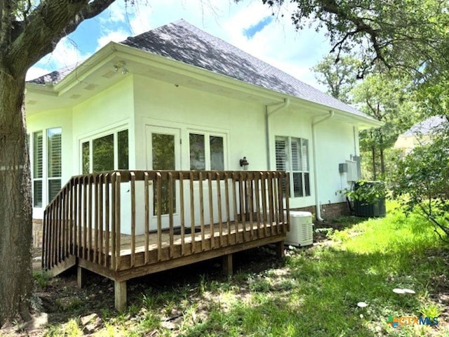 2772 Cloisters Dr, College Station, TX 77845 - back of house featuring a wooden deck, a shingled roof, and stucco siding