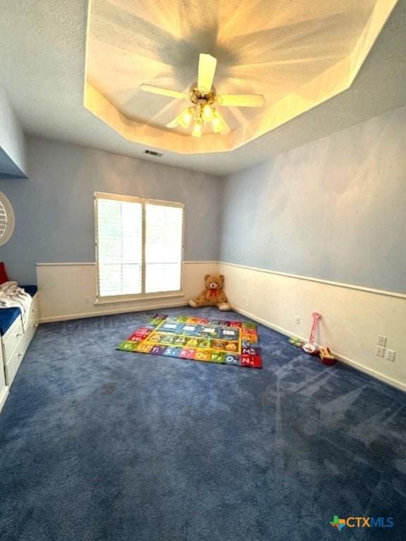 2772 Cloisters Dr, College Station, TX 77845 - rec room featuring a raised ceiling, carpet, and ceiling fan