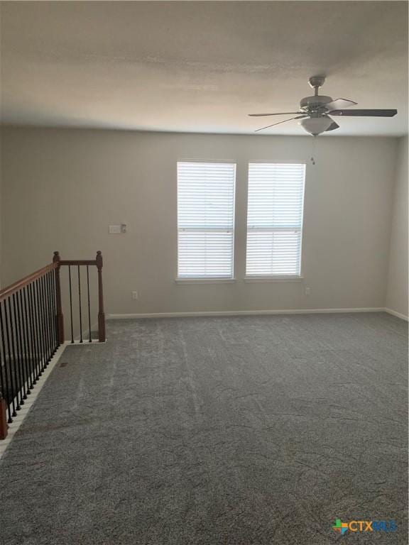 carpeted empty room with ceiling fan