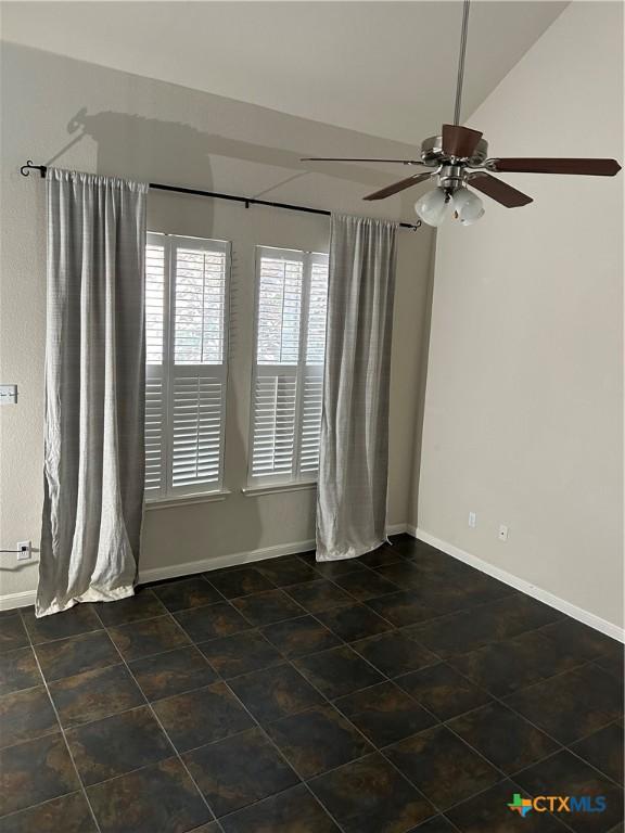 unfurnished room with ceiling fan