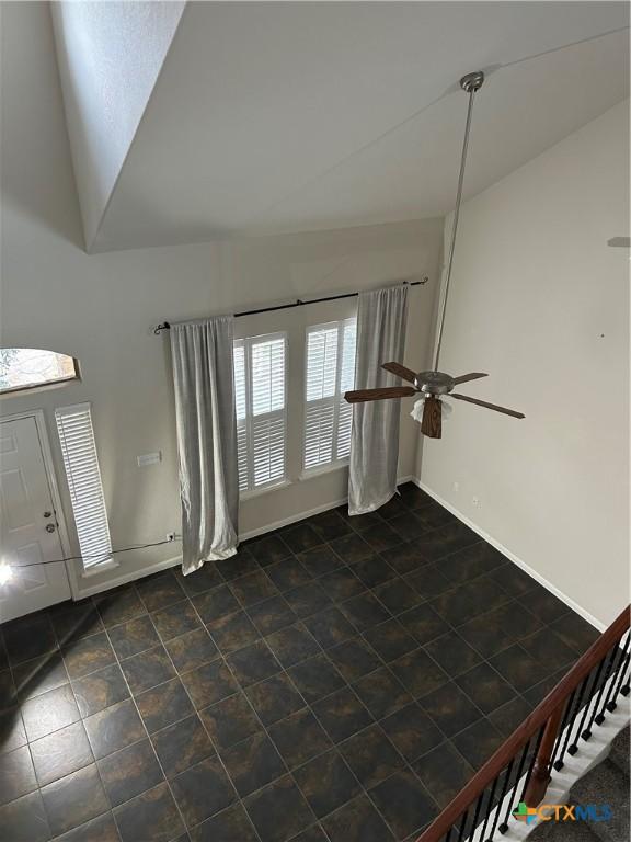 entrance foyer with ceiling fan and lofted ceiling