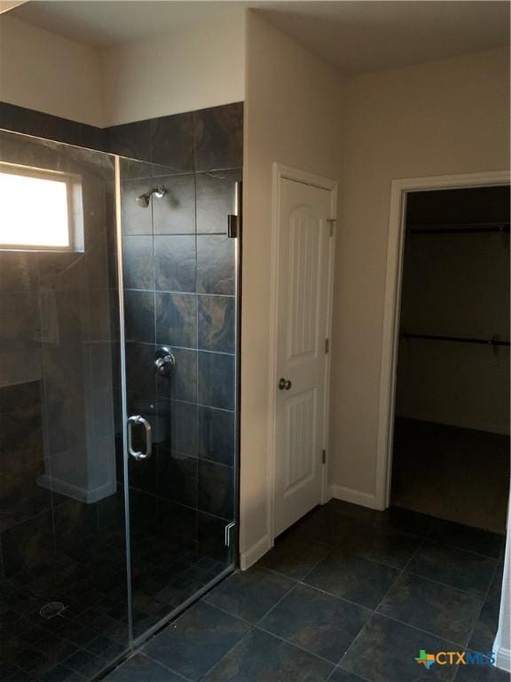 bathroom featuring an enclosed shower