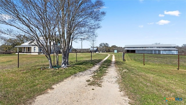 view of street with dirt driveway