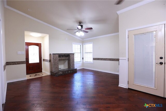 unfurnished living room with wood-type flooring, a premium fireplace, a ceiling fan, baseboards, and ornamental molding