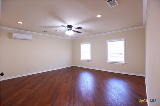 empty room with ornamental molding, a wall unit AC, a ceiling fan, and visible vents