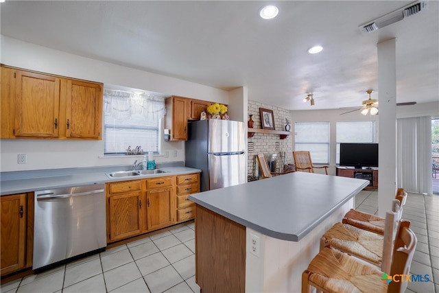 323 E Klein Rd, New Braunfels, TX 78130 - kitchen featuring ceiling fan, sink, stainless steel appliances, and a wealth of natural light