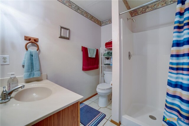 323 E Klein Rd, New Braunfels, TX 78130 - bathroom featuring tile patterned flooring, vanity, curtained shower, and toilet